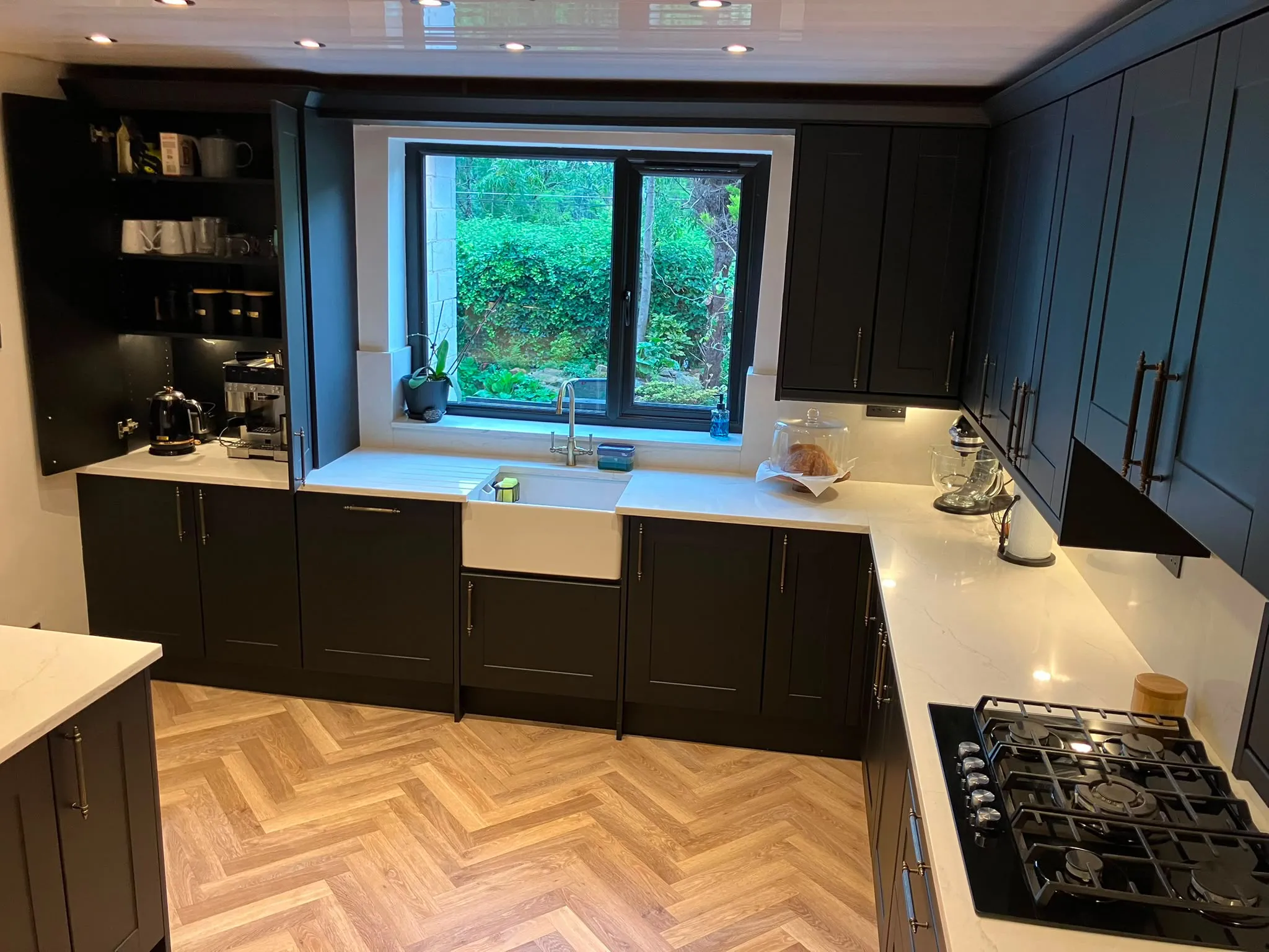Charcoal shaker fitted kitchen with herringbone flooring by LDG Joinery LTD, Bolton
